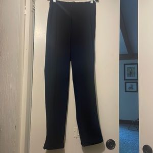 Porto dark navy nylon pant w zip at ankle.